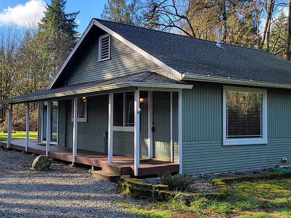Covered front porch and wrap around deck.