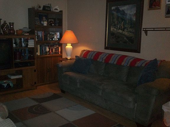 Living room has laminate flooring.