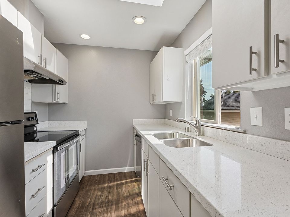 Quartz kitchen with stainless appliances