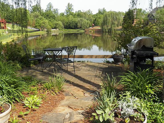 Dock next to backyard pond
