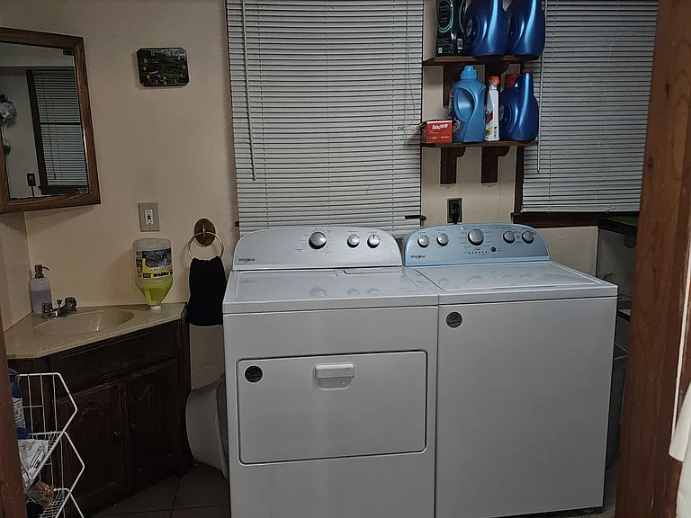 Laundry with Half Bath and lot of storage