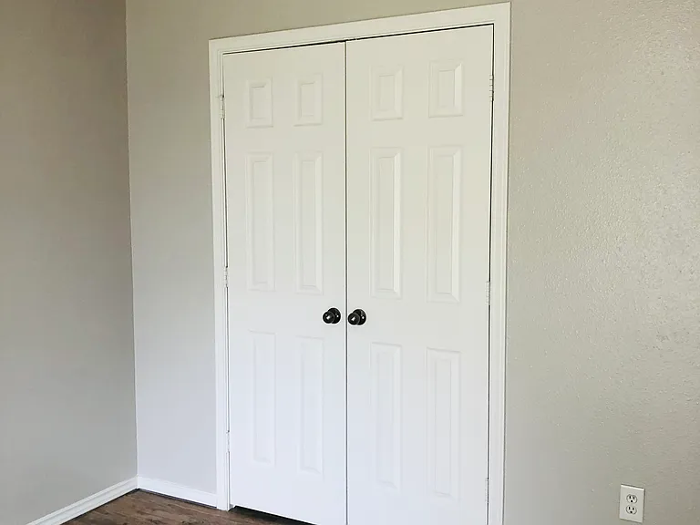 Large walk-in closet in 1st guest bedroom.