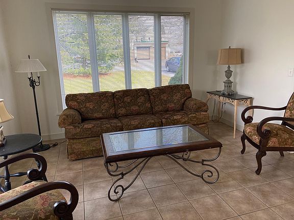 Large Living room with tile flooring