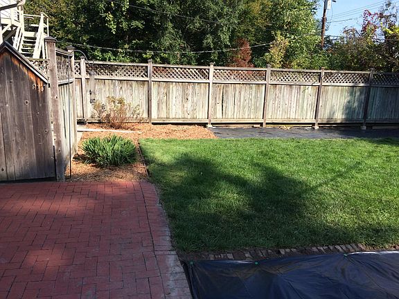 Private, fenced backyard with real brick patio. Not "pavers."