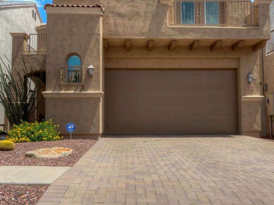 Front of home with 3 car gar