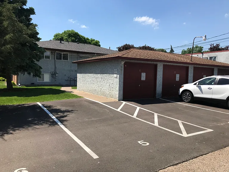 Private parking lot for residents and guests directly behind main building.
