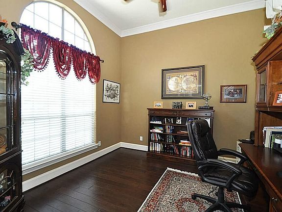 Study offers high ceilings and hardwood floors as well. Located just off of the entry.