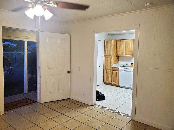 View from front room into Kitchen.