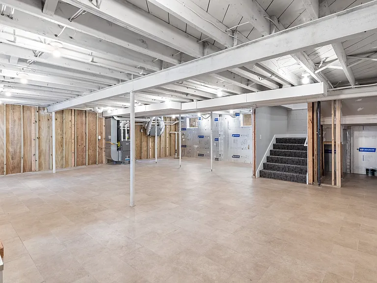 The basement is clean with tiled floors and all new mechanicals. Plenty of room for storage.