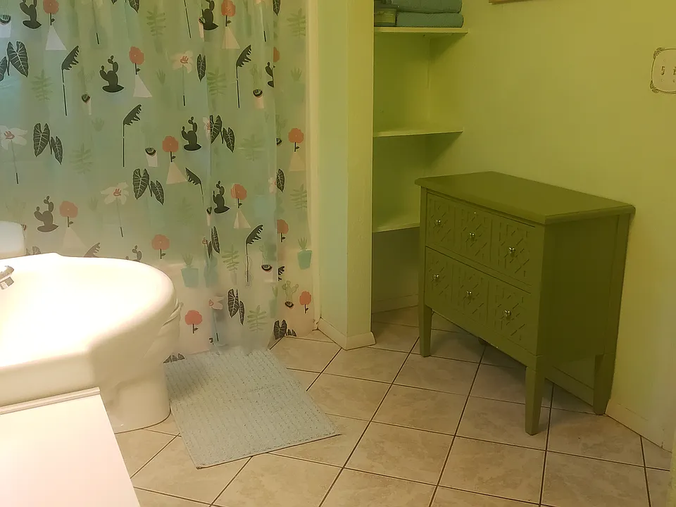 Large bathroom with tub and shower.