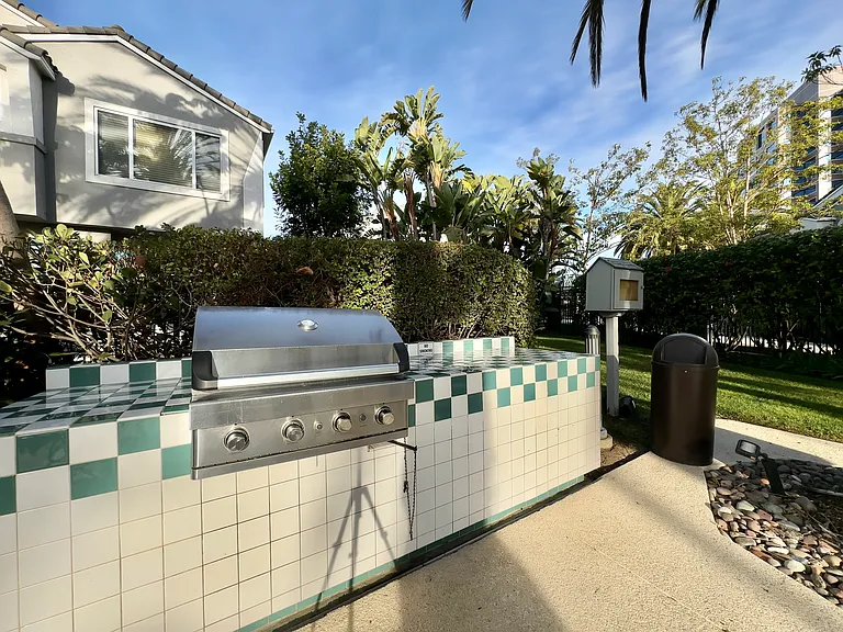 BBQ and free library in community pool area.