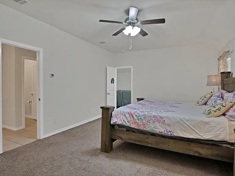 An enclosed bathroom in a master bedroom