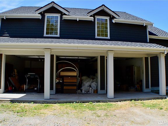 3-car garage does not have posts! Lots of cabinets for storage. Middle section is full of building materials purchased to build 3,000+ home next to garage.