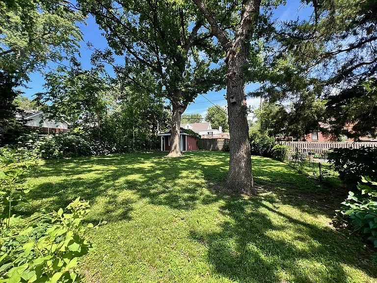 Large shaded back yard with space for a garden.