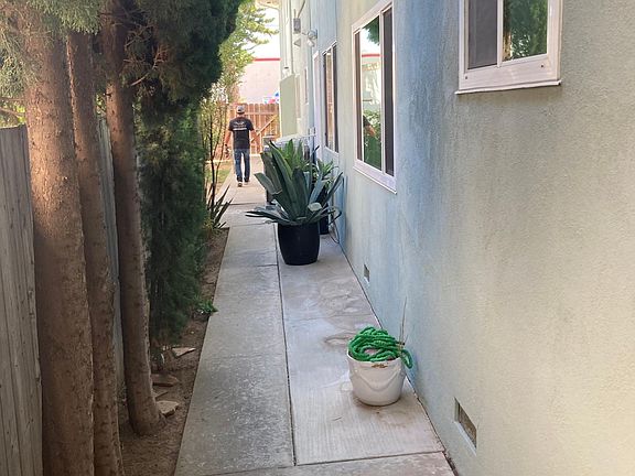 Side yard that leads to the laundry and your 1 car garage.
