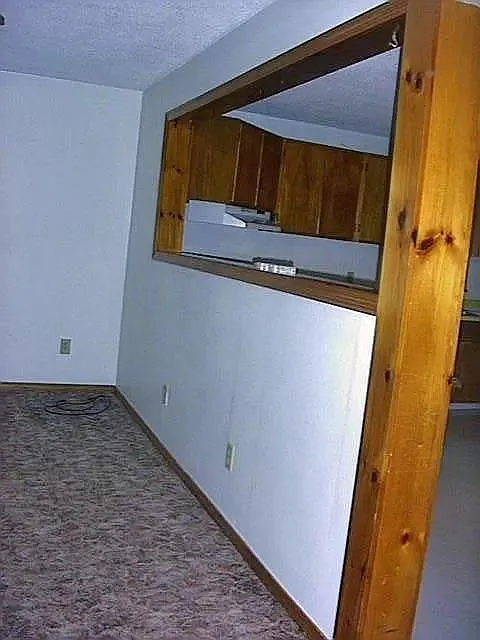 Living room, looking into Kitchen opening