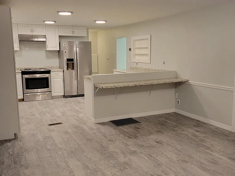 View from dining to kitchen. Showing new tile flooring