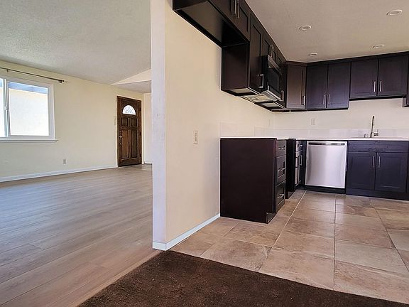 Brand new kitchen with stainless steel and quartz