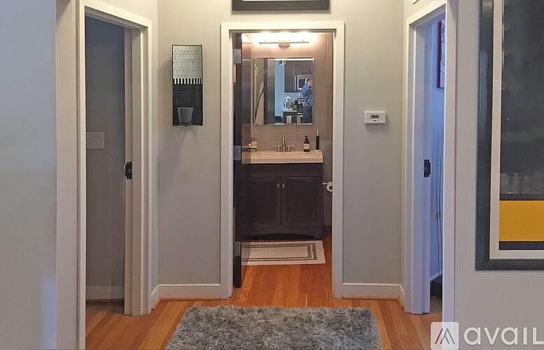 Hall leading to full bath with tub/shower combination