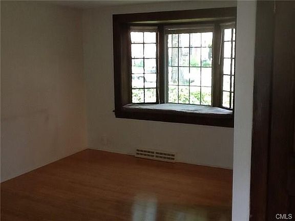 Livingroom with bay window and bamboo floors.