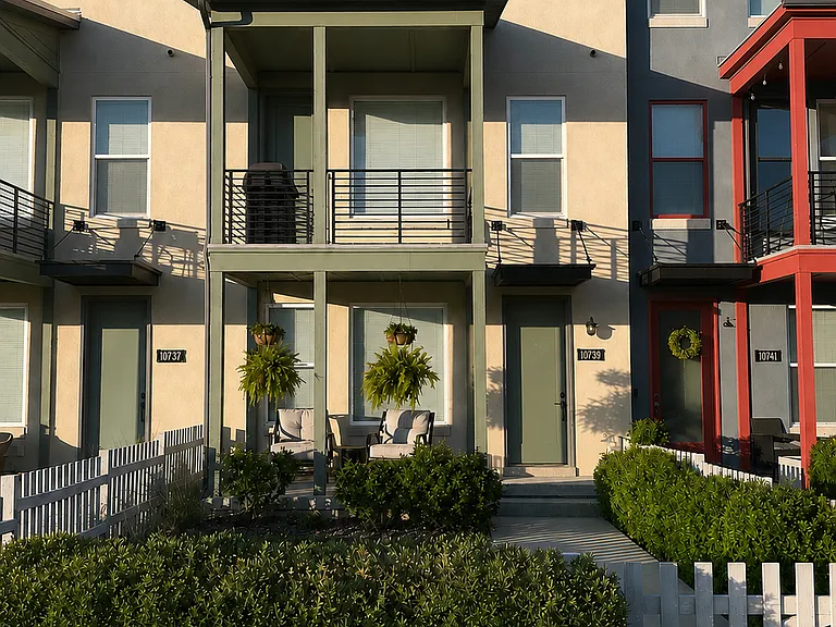 Gated front yard, well kept landscaping and outdoor space.