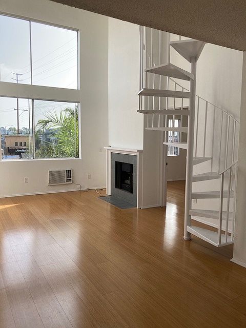 Double-height living room with working gas fireplace
