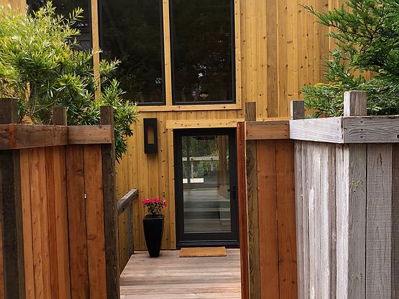 Gated front entrance with decking