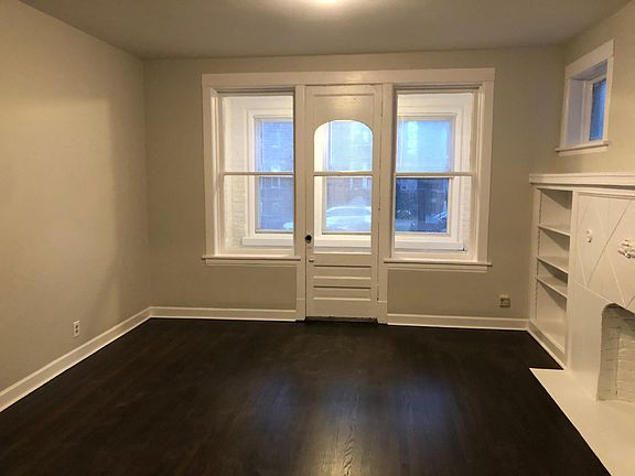 Living Room & Entrance to Private Enclosed Front Poarch Area
