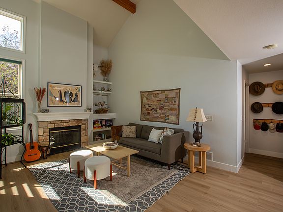 Family room showing hallway alcove with handy hat hooks, leading to the laundry/mudroom and powder room.