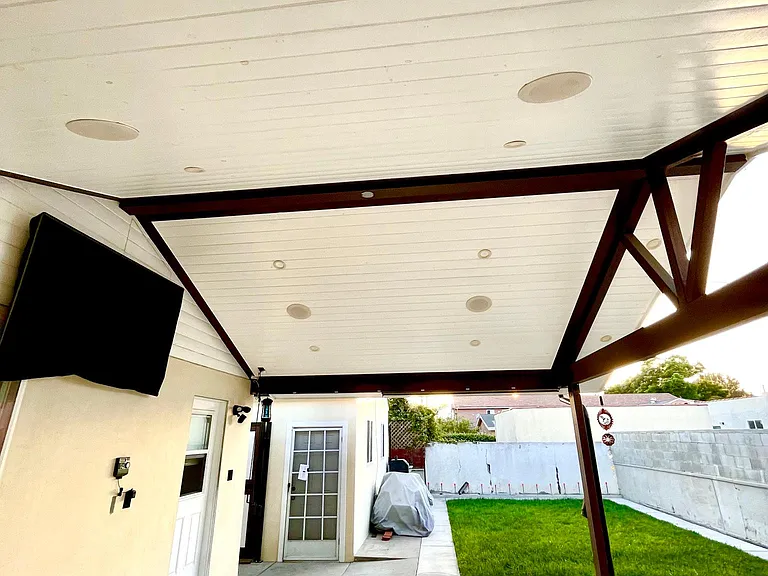 Patio with recessed lighting and built-in speakers. 65" LCD TV mounted and available for purchase.