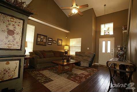 FORMAL LIVING ROOM WITH HARDWOOD FLOORS