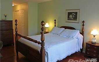 Notice the newer hardwood floors in both main floor bedrooms.