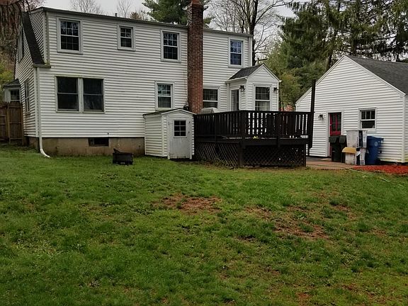 Back view of the house, deck, and garage
