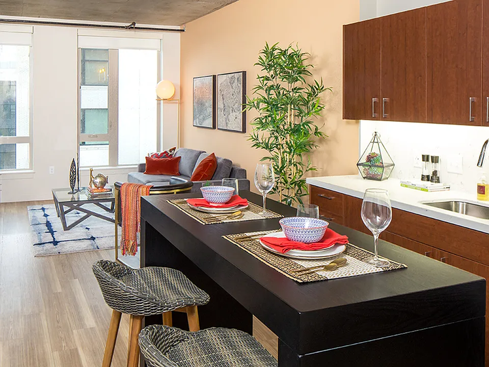Modern kitchens outfitted with stainless steel appliances, and quartz countertops with tile backsplashes