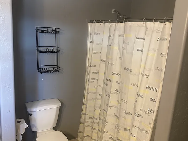 2nd full bathroom downstairs, across from the 2nd bedroom.