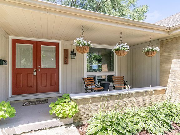 Covered porch to enjoy the quiet, peaceful neighborhood.