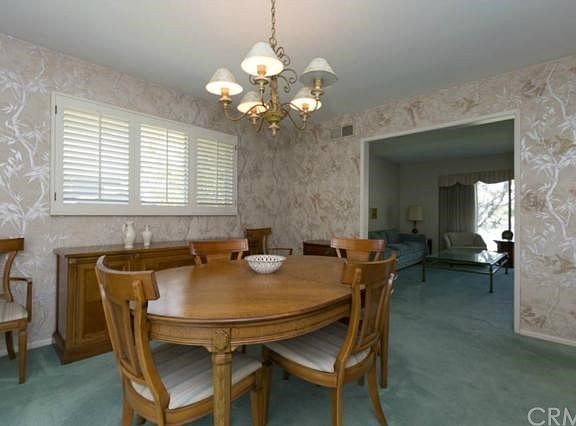 Formal dining room opens to living room and kitchen