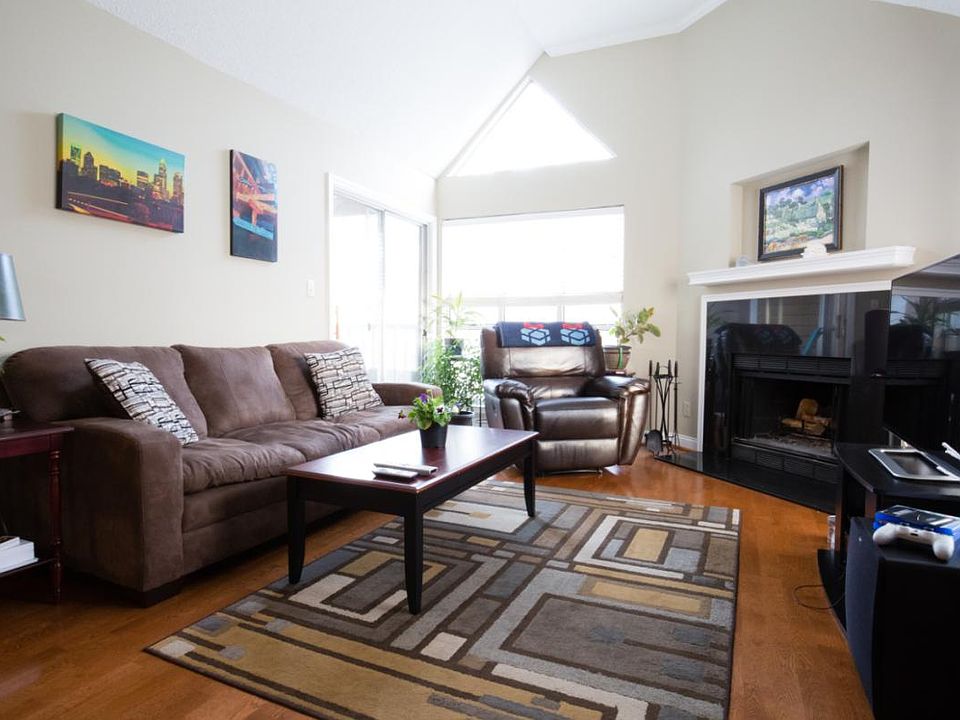 Comfy living room with fireplace. Home theater includes 49"T