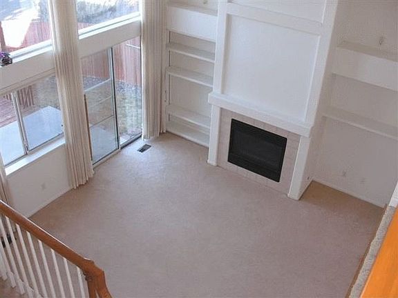 Vaulted family room with gas-log fireplace.