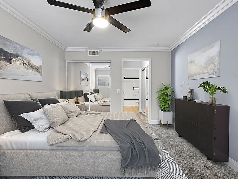 Large bedroom with ceiling fan.