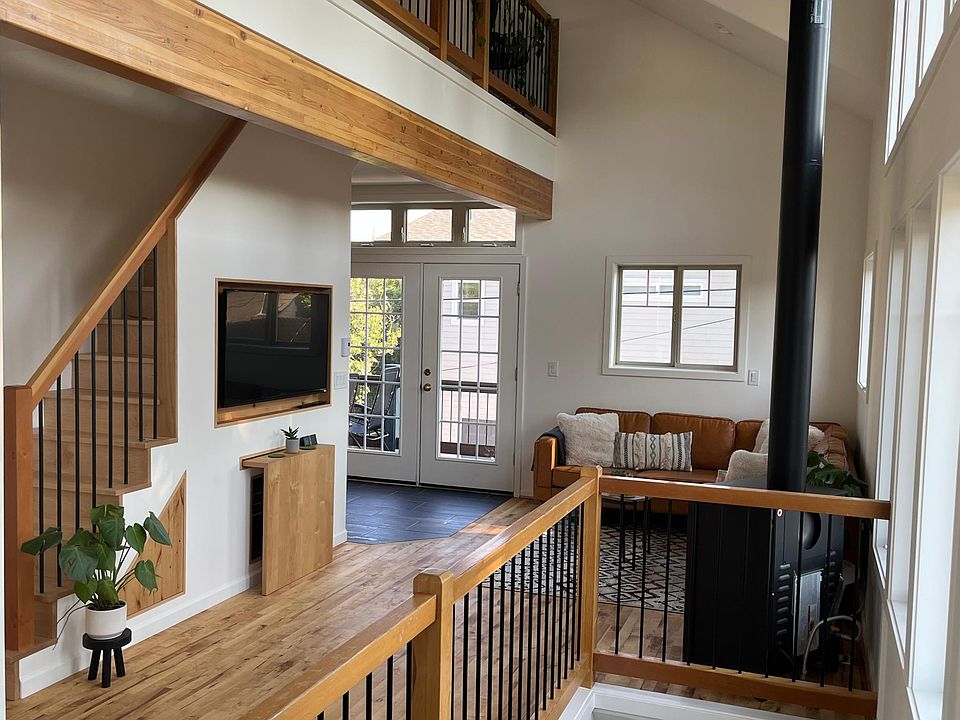 Large living area, full of natural light. Pull out eating/work area and cozy fireplace.