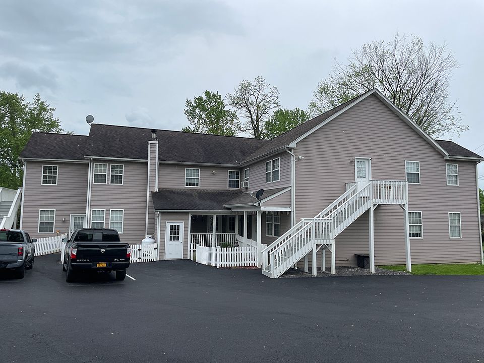 Apt 2C is at the top right of this photo, up the private exterior staircase. The parking lot was repaved this spring.