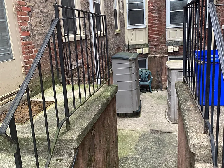 secure storage area in private yard (shared alley with neighbor)