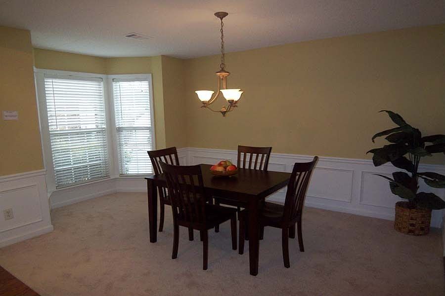 Beautiful bay window brings the morning sunshine into the Dining Room.