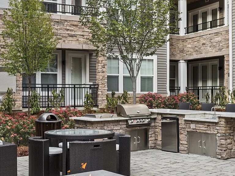 Beautifully Landscaped Courtyard with Firepits, Wet Bar, Seating Areas, Entertaining Space, and an Outdoor TV