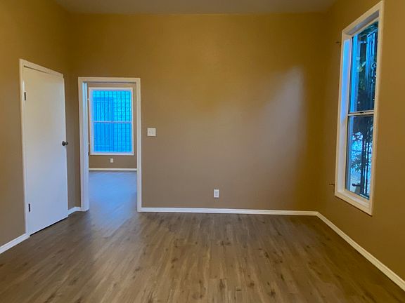 This is the bedroom with a view of the living room through the connecting door.