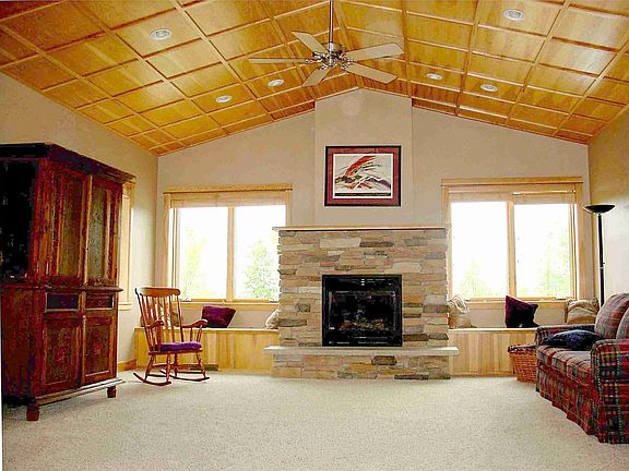 Great room w/ dramatic ceiling & recessed lightng.  Walk-out to patio.