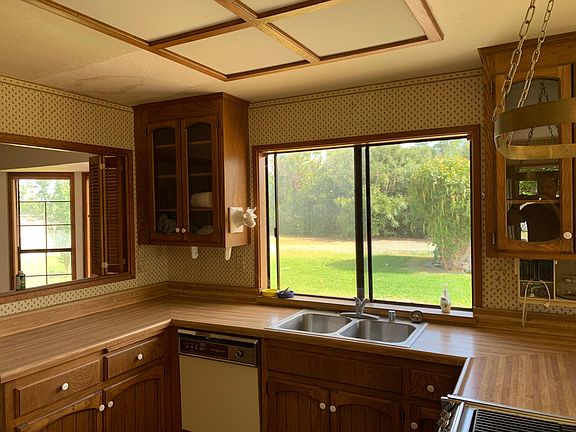 country kitchen with dishwasher and range