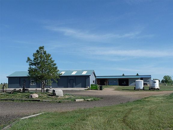 Huge garage/Shop and 2 Barns.