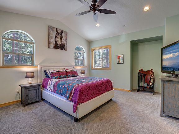 Private primary suite with vaulted ceiling and generous space to unwind